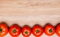 Red tomatoes on wooden ground Royalty Free Stock Photo