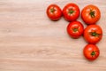 Red tomatoes on wooden ground Royalty Free Stock Photo