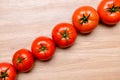 Red tomatoes on wooden ground Royalty Free Stock Photo