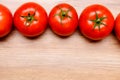 Red tomatoes on wooden ground Royalty Free Stock Photo