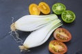 Red tomatoes, yellow and scallions