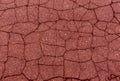 Red toned damaged asphalt texture. Royalty Free Stock Photo