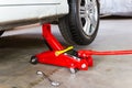 Red tool jack lift car for repair check Maintenance