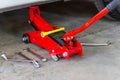 Red tool jack lift car for repair check