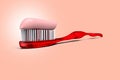 A red toothbrush with toothpaste on a red background Royalty Free Stock Photo