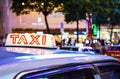 Red Top Sign of Hong Kong Taxi at Busy City Centre Royalty Free Stock Photo