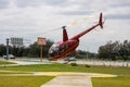 Red tourist helicopter takes off for sightseeing journey in Orlando