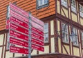 Red tourist sign in front of a half timbered house in Wernigerode Royalty Free Stock Photo