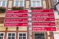 Red tourist sign in front of a historic house in Wernigerode