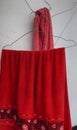 Red towel hanging on other hanger Royalty Free Stock Photo