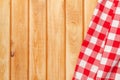 Red towel over wooden kitchen table Royalty Free Stock Photo