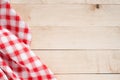 Red towel over wooden kitchen table Royalty Free Stock Photo