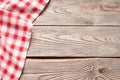 Red towel over wooden kitchen table Royalty Free Stock Photo