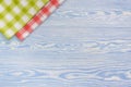 Red towel over wooden kitchen table. View from above with copy space Royalty Free Stock Photo