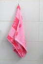 Red towel for wipe hand in toliet room on wall Royalty Free Stock Photo