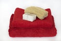 Red towels with soap and luffa Royalty Free Stock Photo