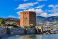 Red tower Kizil Kule in Alanya on a cloudy day Royalty Free Stock Photo