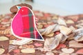 Red toy bird and cookies on dark napkin with image of hearts