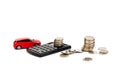 Red toy car, calculator and key with coins, isolated on white background. Space for text