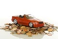 Red toy car on coins Royalty Free Stock Photo