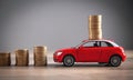 Red toy car and coins on the desk Royalty Free Stock Photo