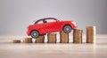 Red toy car and coins on the desk Royalty Free Stock Photo