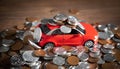 Red toy car and coins on the desk Royalty Free Stock Photo