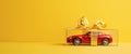 A Red Toy Car In A Gift Box With A Yellow Bow Royalty Free Stock Photo