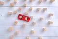 Red toy car overcomes all obstacles and barriers reaching the goal. Royalty Free Stock Photo