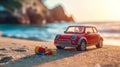 Red Toy Car on Sandy Beach at Sunset Royalty Free Stock Photo