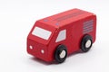 A red toy car in wood on white background Royalty Free Stock Photo