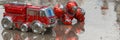 Reflections of Red Toy Fire Engine and Robot Doll on Wet Surface, Enhancing Details With High Fidelity Upscaling Royalty Free Stock Photo