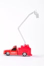 Red toy fire truck, white background. Royalty Free Stock Photo