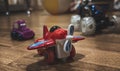 Red toy plane on the floor Royalty Free Stock Photo