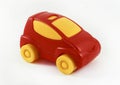 Red toy plastic car with yellow wheels and yellow glasses. Children toy Royalty Free Stock Photo