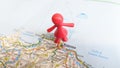 A Toy woman man standing on Palermo on a map of Italy Royalty Free Stock Photo