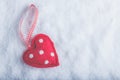 Red toy suave heart on a frosty white snow background. Love and St. Valentine concept. Royalty Free Stock Photo