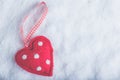 Red toy suave heart on a frosty white snow background. Love and St. Valentine concept. Royalty Free Stock Photo