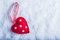 Red toy suave heart on a frosty white snow background. Love and St. Valentine concept. Royalty Free Stock Photo