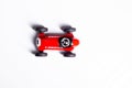 Red toy vintage racing car close up still isolated on a white background Royalty Free Stock Photo