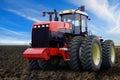 Red tractor on field Royalty Free Stock Photo