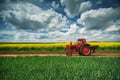Red tractor in a field Royalty Free Stock Photo