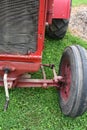Red tractor front axle view