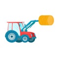 Red tractor with front loader lifting a hay bale. Farm machinery at work, agricultural equipment theme. Farming Royalty Free Stock Photo