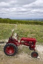 Red tractor near Monbazillac castle (Chateau de Monbazillac), Dordogne department, Aquitaine, France