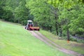 Red Tractor Pulling Disco Across Dirt Path Royalty Free Stock Photo