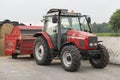 Red tractor with red cattle feed diffuser