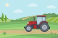 Red tractor on rural landscape background.