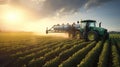 Red tractor spraying pesticides on soybean field for optimal crop growth and pest control Royalty Free Stock Photo