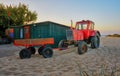 Red tractor with trailer at the fisherman house on the beach in Ahlbeck. Germany Royalty Free Stock Photo